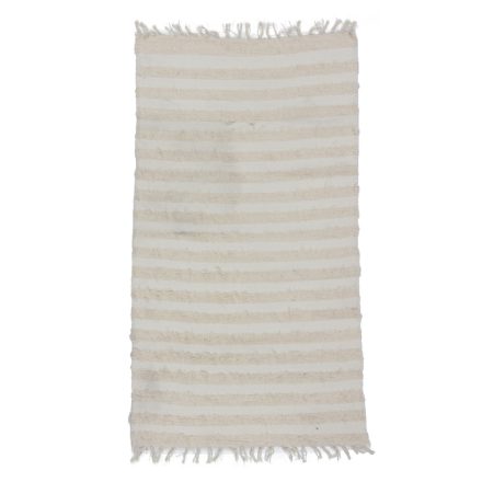 Puszysty dywan beżowy 69x125 miękki dywan szmaciany